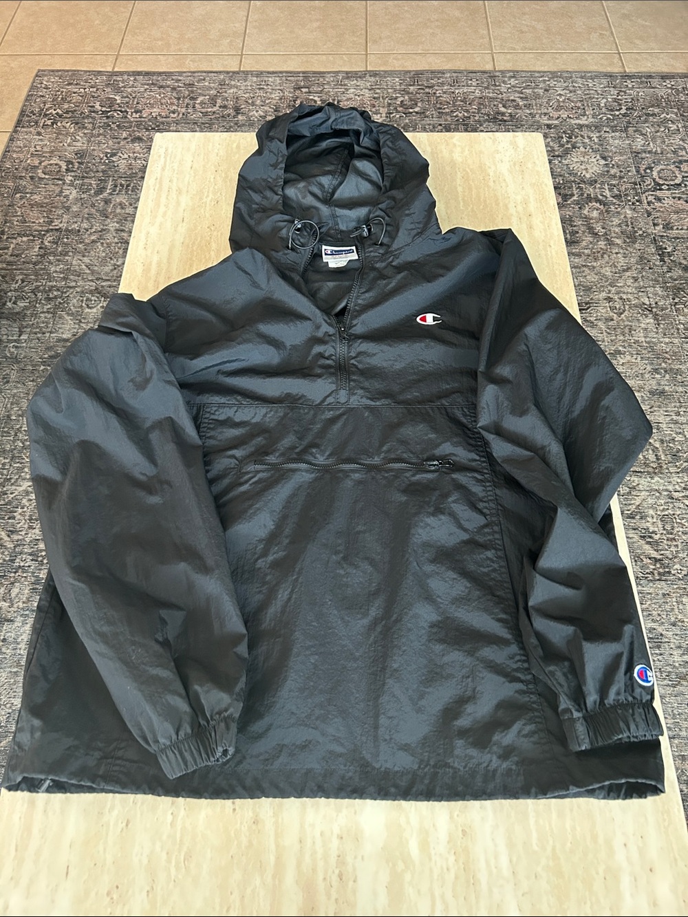 Champion Black Hooded Pullover (windbreaker) jacket.